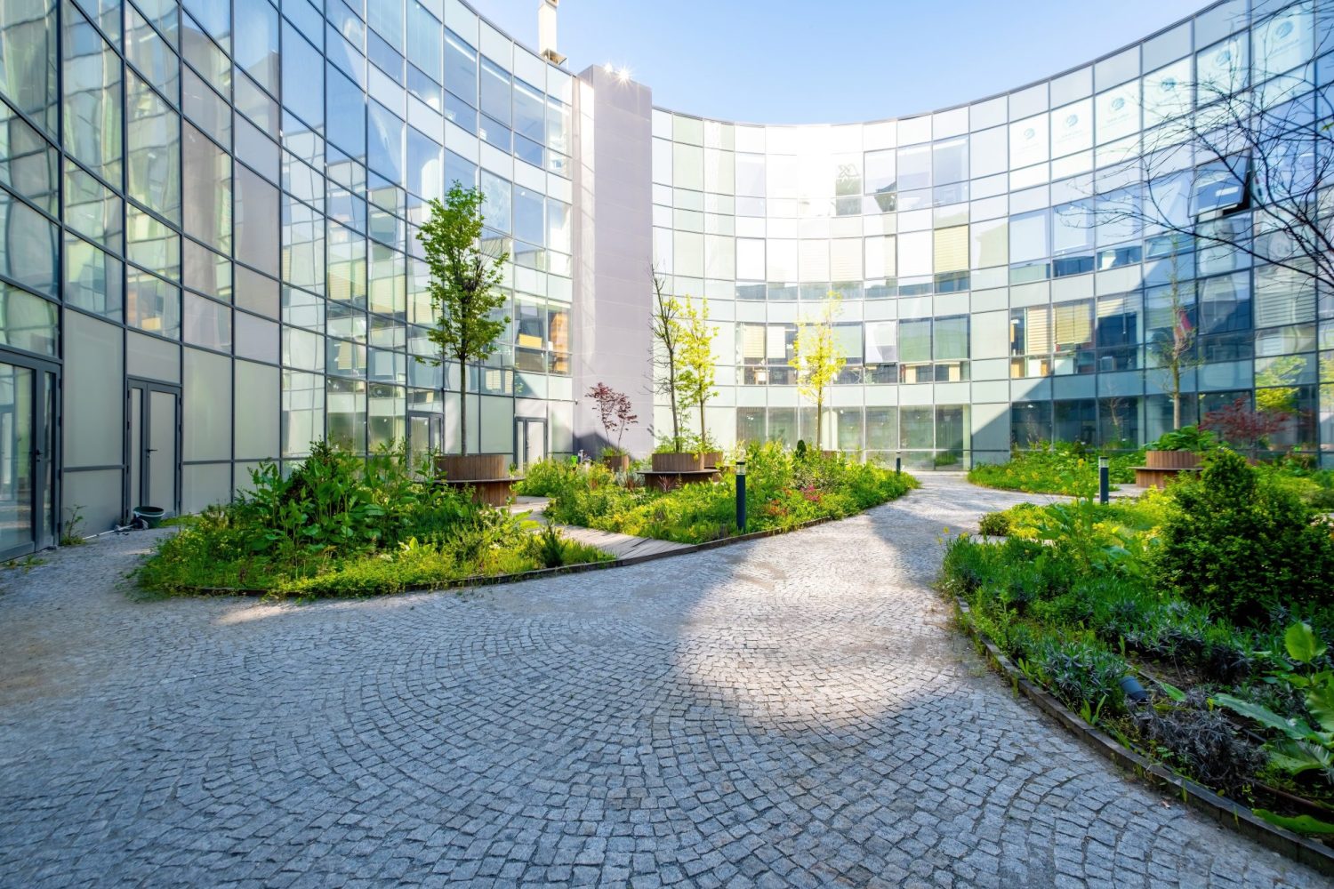 Modern,Round,Office,Building,With,Garden